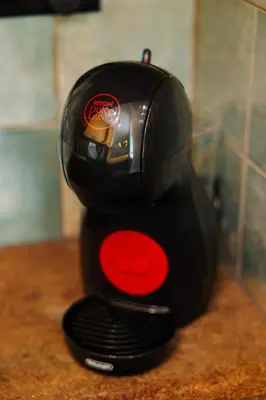 a black and red mixer sitting on a counter at Jungle Apartment chill&bed Zator in Zator
