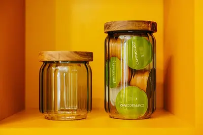 two glass jars sitting on top of a shelf at Jungle Apartment chill&bed Zator in Zator