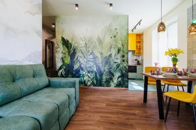 a living room with a couch and a table at Jungle Apartment chill&bed Zator in Zator