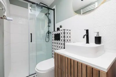 a bathroom with a toilet and a sink and a shower at Krowoderska 55 - by Upstairs in Kraków