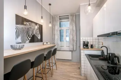 a kitchen with a zebra picture on the wall at Apartament Lubomirskiego Centrum Kraków in Kraków