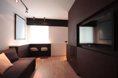a living room with a couch and a flat screen tv at Modern Studio Apartments Old Town-Kazimierz in Kraków
