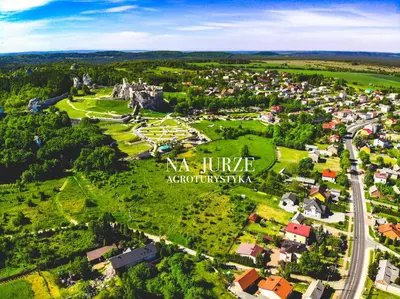 an aerial view of a small town with a castle at Agroturystyka na Jurze Apartamenty z widokiem na Zamek Jacuzzi Sauna Beczka in Ogrodzieniec