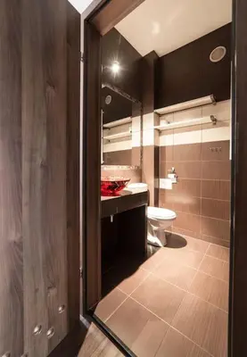 a bathroom with a sink and a toilet in it at Komfortowy apartament z klimatyzacją in Kraków
