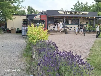 a store with purple flowers in front of it at Bagry Rooms2 - Apartament z sypialnią i miejscem postojowym in Kraków