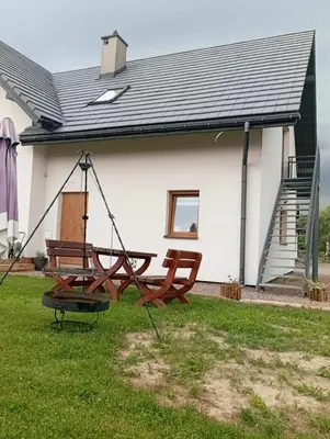 a swing in front of a house at Blisko Energylandii in Zator