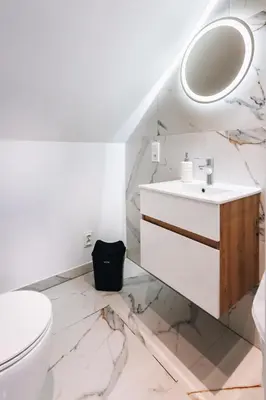 a bathroom with a sink and a toilet at Zawoja House in Zawoja