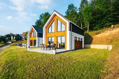 a house on a hill with a yard at Zawoja House in Zawoja