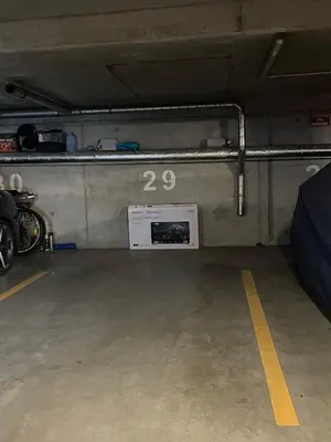 a garage with a room with a sign on the wall at Apartament Jana 14 z garażem podziemnym in Bochnia