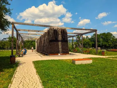 a park with a large structure in the grass at Bagry Lake Apartment in Kraków
