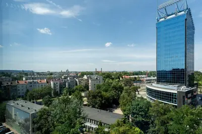 a view of a city with a tall building at Glossy Apart G30 in Kraków