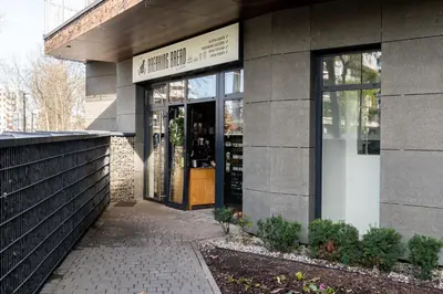 a building with the entrance to a wine store at Glossy Apart G30 in Kraków