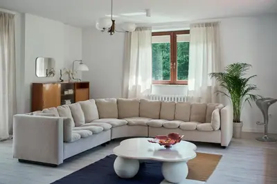 a living room with a couch and a table at Blisko in Wieprz