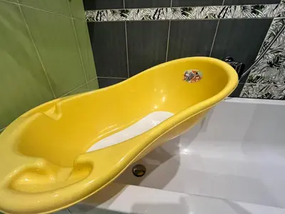 a yellow toilet in a bathroom with a shower at Cracow Stay Premium Apartments FREE PARKING - 3 x ROOM - 3 x AIRCONDITION in Kraków