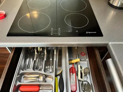 a drawer in a kitchen filled with utensils at Cracow Stay Premium Apartments FREE PARKING - 3 x ROOM - 3 x AIRCONDITION in Kraków