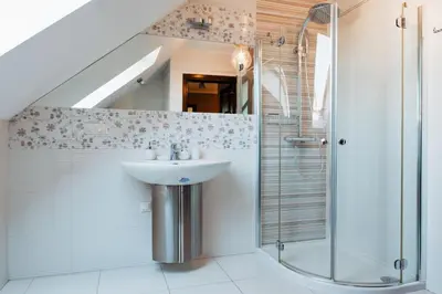 a bathroom with a sink and a shower at Zagornik in Inwałd