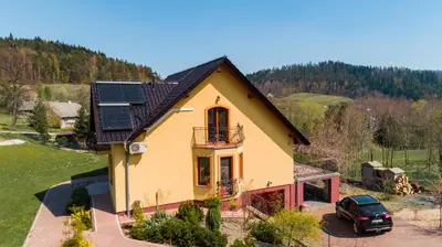 a house with solar panels on top of it at Zagornik in Inwałd