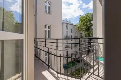 a balcony with a view of a building at Studio apartment with balcony - Starowiślna 41 in Kraków