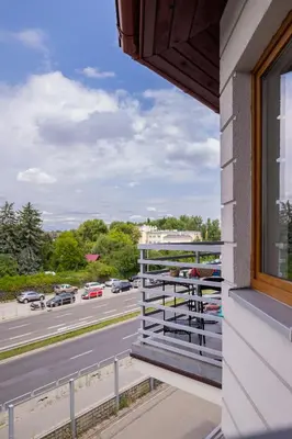 a balcony with a view of a highway at Apartament Rodzinny z 2 Sypialniami & Klimatyzacja by Noclegi Renters in Kraków