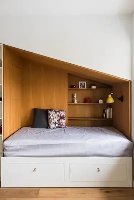 a bedroom with a bed with a wooden headboard at Heart of Cracow - AC - Retoryka 24 in Kraków