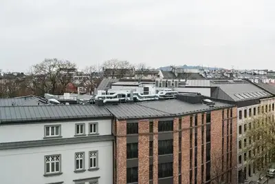 arial view of a city with buildings and roofs at Heart of Cracow - AC - Retoryka 24 in Kraków