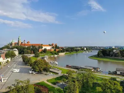 a view of a river with a town and a city at Heart of Cracow - AC - Retoryka 24 in Kraków