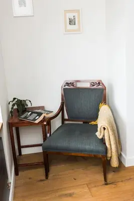 a chair sitting next to a desk with a desk at Penthouse - Heart of Cracow - Balcony - AC in Kraków