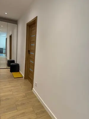 a hallway with a door and a room at Apartament 2 Willa Bellevue in Rabka-Zdroj