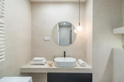 a bathroom with a sink and a mirror at Grzegórzki Apt - Balcony, AC, Shops&Tram nearby - by Rentujemy in Kraków