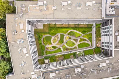 an overhead view of a building with a garden at Grzegórzki Apt - Balcony, AC, Shops&Tram nearby - by Rentujemy in Kraków