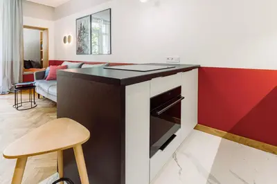 a kitchen with a counter and a stove top oven at Rzeszowska 5 Apt 7 Stylowy pobyt in Kraków