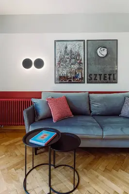 a living room with a blue couch and a table at Rzeszowska 5 Apt 7 Stylowy pobyt in Kraków