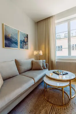 a living room with a couch and a table at Rzeszowska 5 Apt 12 Stylowy pobyt in Kraków