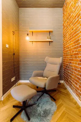 a room with two chairs and a brick wall at Rzeszowska 5 Apt 12 Stylowy pobyt in Kraków