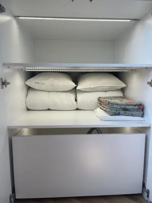 a white bunk bed with pillows on it at Sunflower Apartment Kalwaryjska Street in Kraków