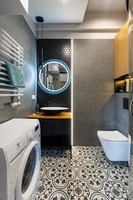 a bathroom with a washing machine and a mirror at Sunflower Apartment Kalwaryjska Street in Kraków