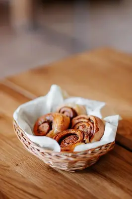 a basket of bagels sitting on a table at JÓZEFÓWKA Stara Stodoła in Zagórze
