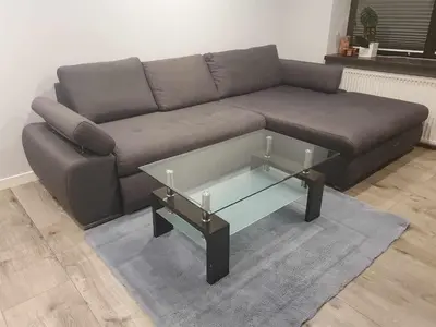 a living room with a couch and a glass coffee table at Dom na wsi w okolicy ENERGYLANDIA ZATOR in Łączany