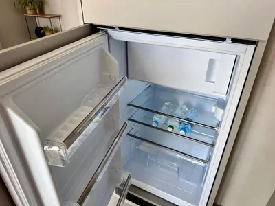 an empty refrigerator with its door open in a kitchen at Vidok Residence Apartments in Młoszowa