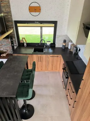 a kitchen with a counter and a sink and a window at Domek Stróski in Wola Stróska