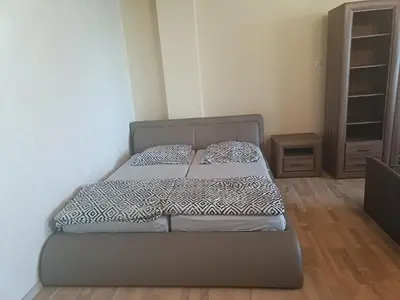 a bed in a room with two pillows on it at apartament blisko Energylandii in Zator