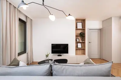 a living room with a couch and a tv at Comfort Corner in Kraków - by Upstairs in Kraków