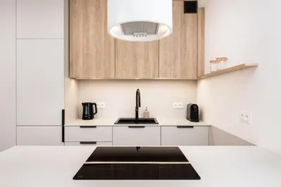 a kitchen with white cabinets and a sink at Comfort Corner in Kraków - by Upstairs in Kraków
