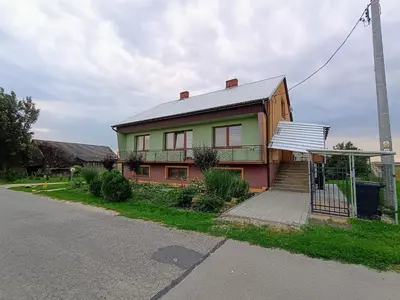 a house on the side of a street at Studio nad S-ką in Brzuchania
