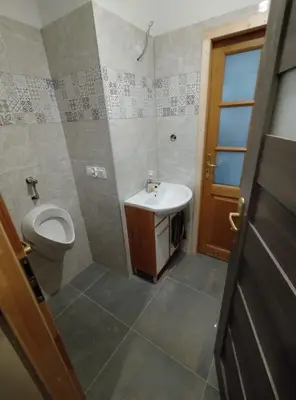 a bathroom with a toilet and a sink at Studio nad S-ką in Brzuchania