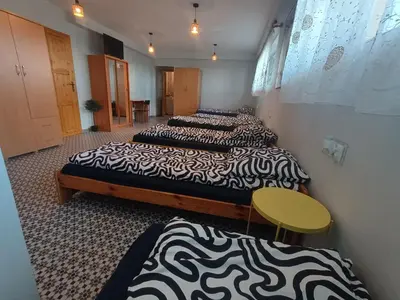 a group of three beds in a room at Studio nad S-ką in Brzuchania