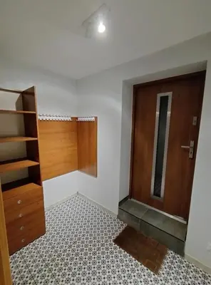 a room with a closet and a wooden door at Studio nad S-ką in Brzuchania