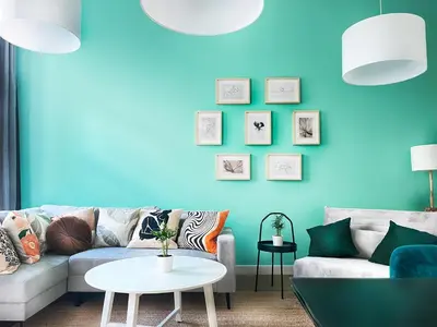 a living room with a couch and a blue wall at Beautiful Apartment for 8 people in Cracow's heart in Kraków