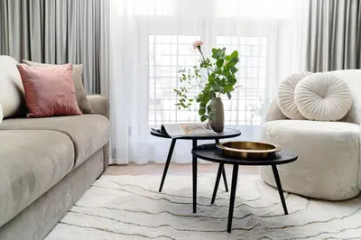 a living room with a couch and a table at Miodova20 by StayLab in Kraków