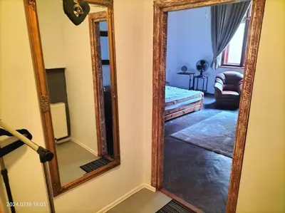 a mirror on a wall in a room at ChilLoud - apartament na Kazimierzu in Kraków